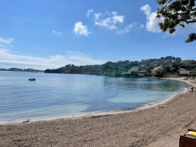 An empty stretch of beach in Beaulieu-sur-Mer on the French Riviera during a sunny day in March.